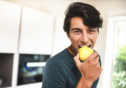 Man enjoying eating an apple
