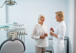 a patient discussing her dentures in Green Hills
