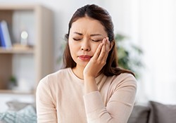 An unhappy woman suffering from a toothache