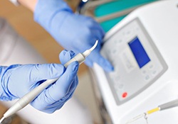 Dental team member preparing to use a laser